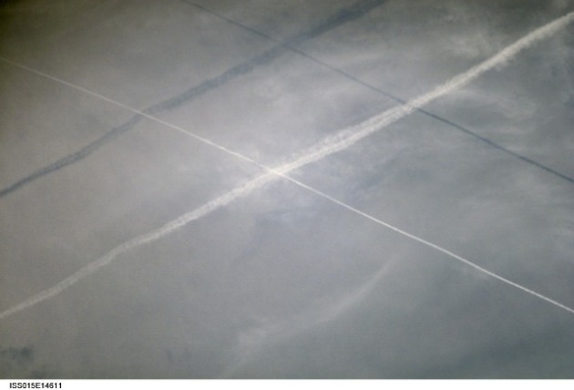 Satellite view of Celebes Sea showing chemtrails and their shadows. (NASA)